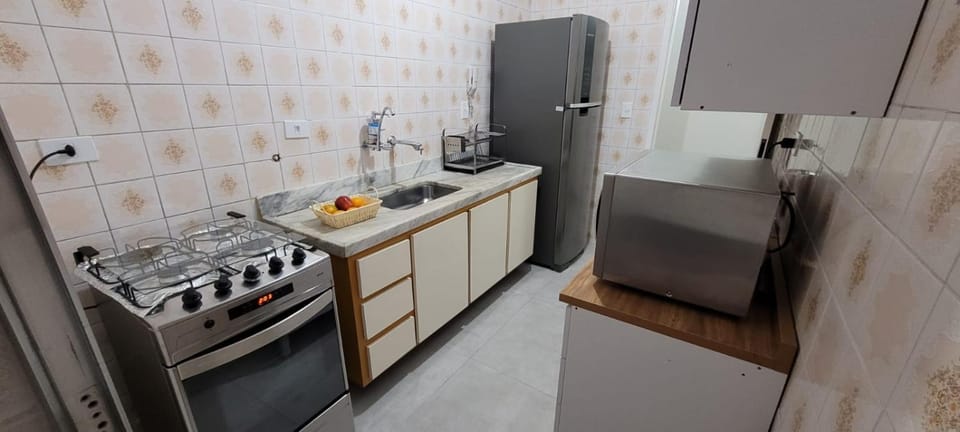 Apartamento na Enseada ambiente familiar e confortável Apartment in State of São Paulo