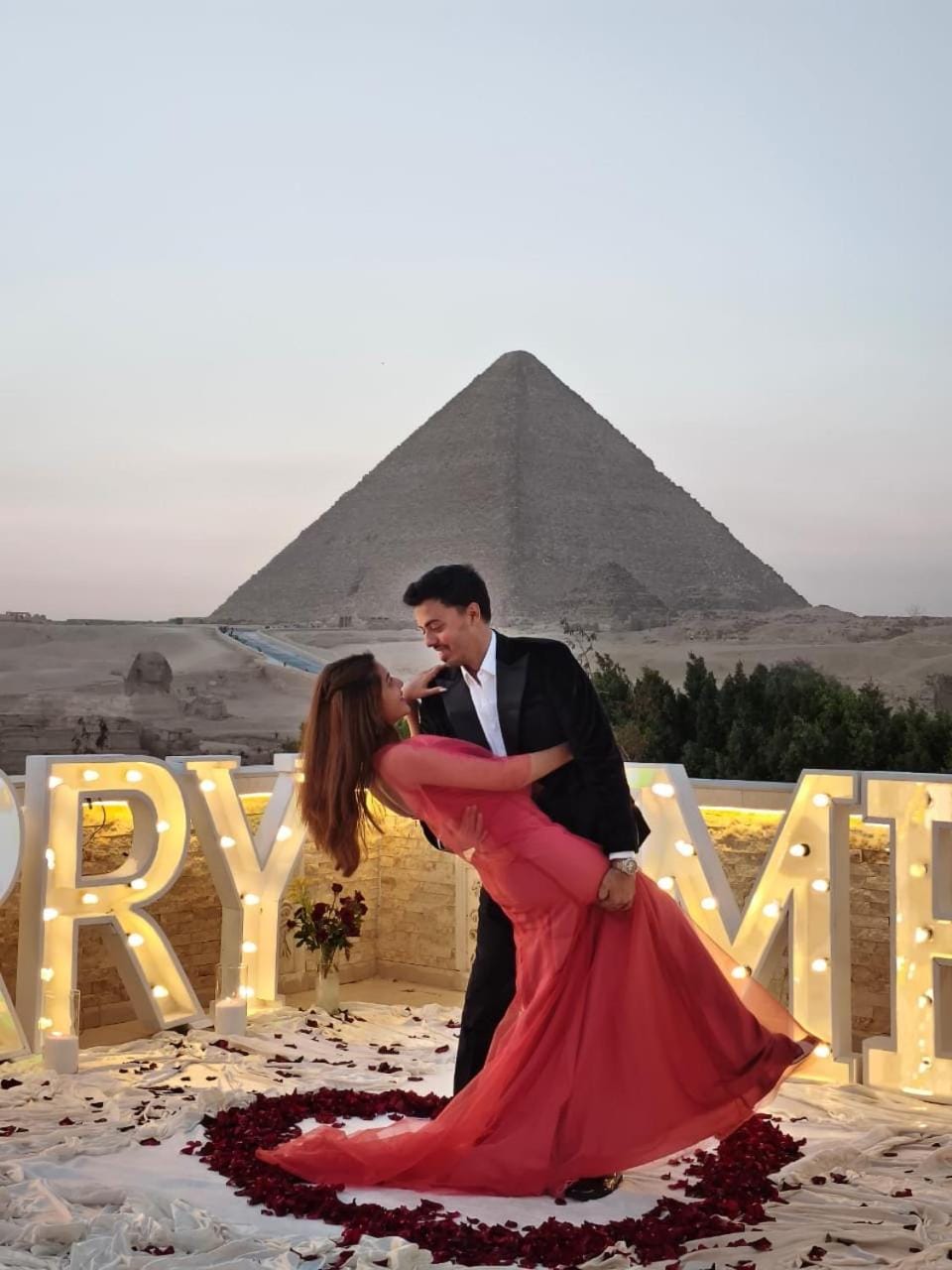 Nearby landmark, People, Natural landscape, Text overlay, Mountain view, group of guests, wedding