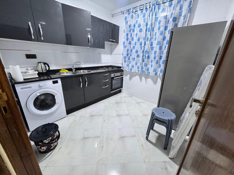 Kitchen or kitchenette, oven, stove, washing machine