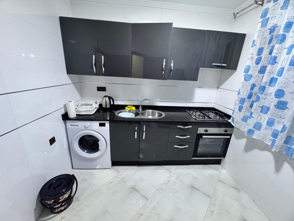 Kitchen or kitchenette, oven, stove, washing machine