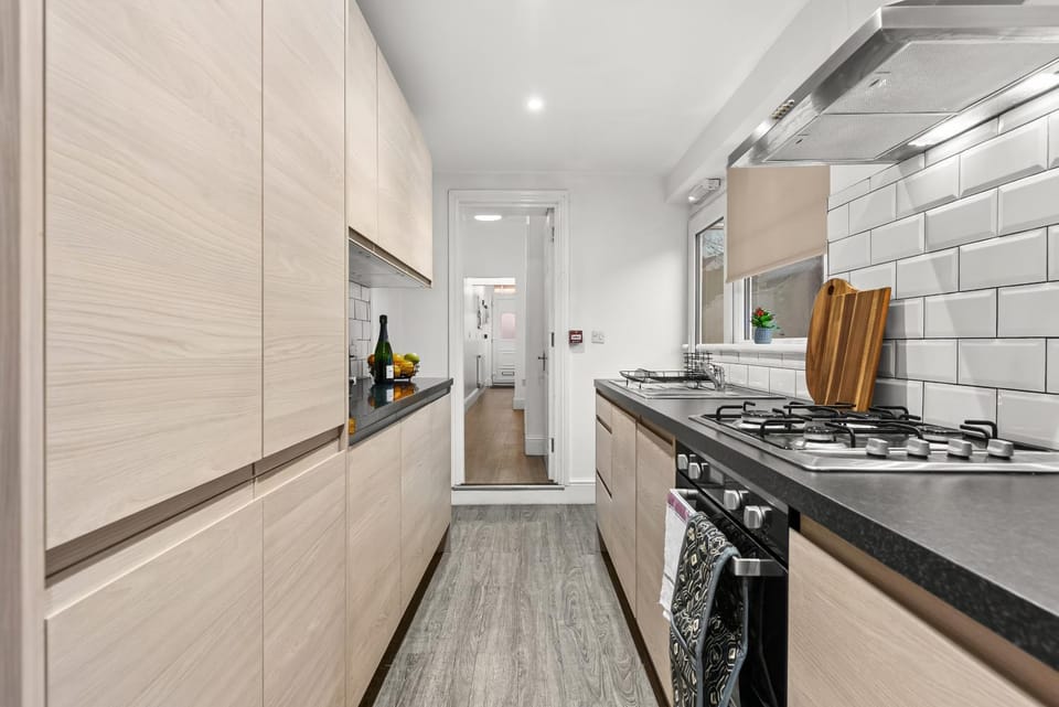 Kitchen or kitchenette, dishwasher, oven, stove