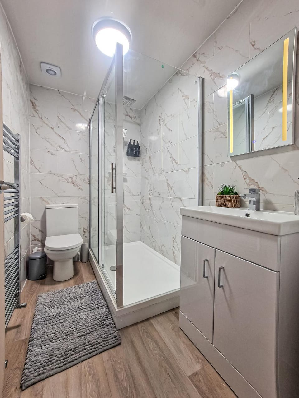 Shower, Toilet, Bathroom, hair dryier, towels