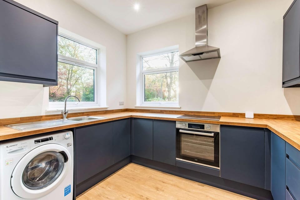 Kitchen or kitchenette, oven, stove, washing machine, dryer