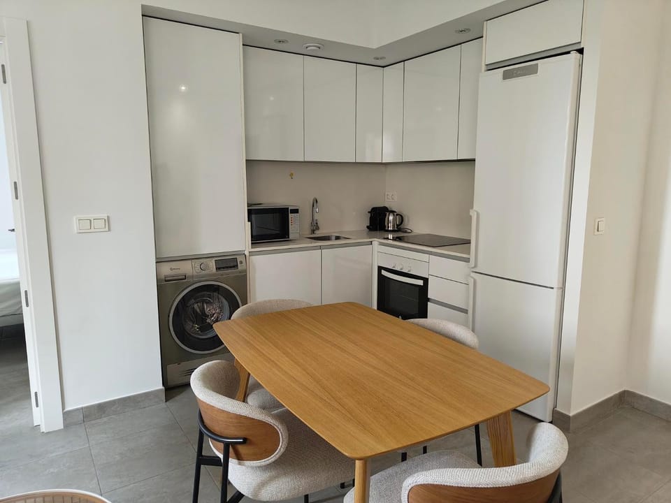 Kitchen or kitchenette, Dining area, dishwasher, oven, washing machine, dryer