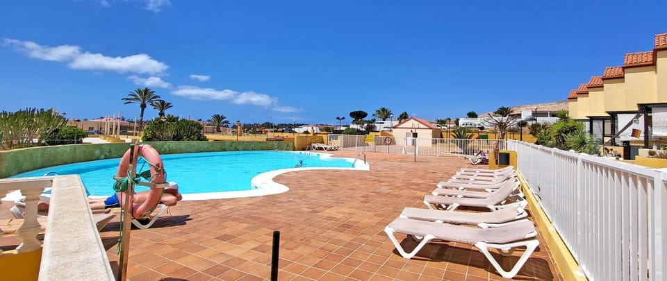 Patio, Day, Natural landscape, Pool view, Swimming pool, sunbed