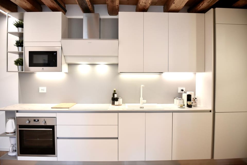 Kitchen or kitchenette, dishwasher, microwave, oven