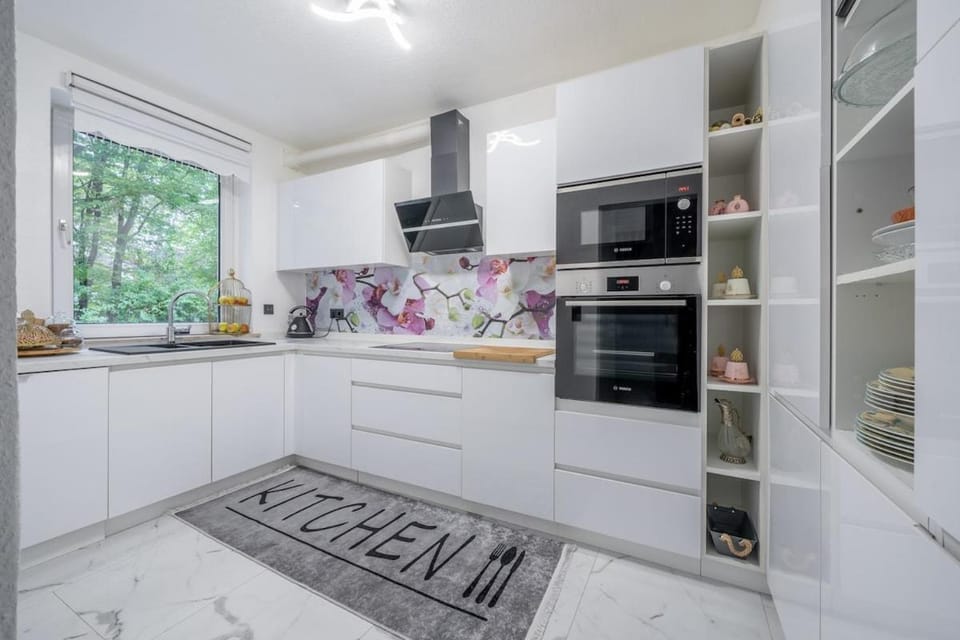 Kitchen or kitchenette, dishwasher, microwave, oven, stove, toaster