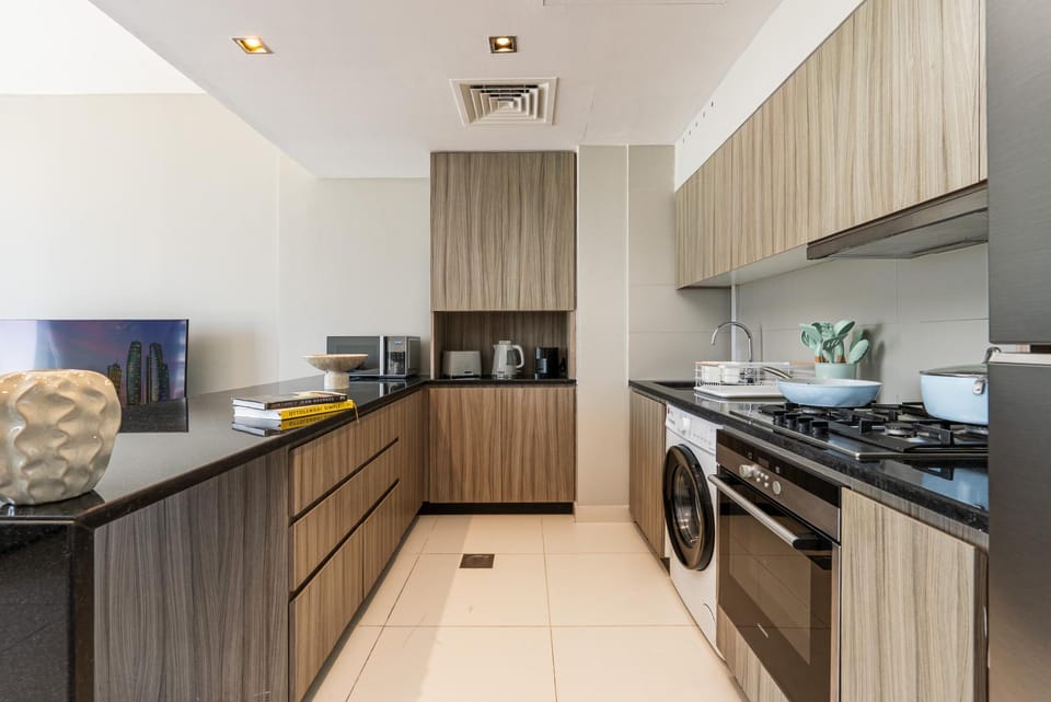 Kitchen or kitchenette, oven, stove, washing machine