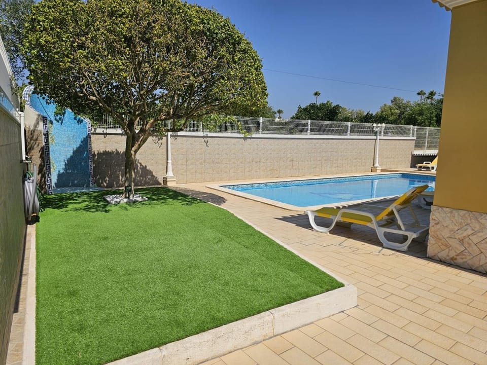 Property building, Living room, Swimming pool