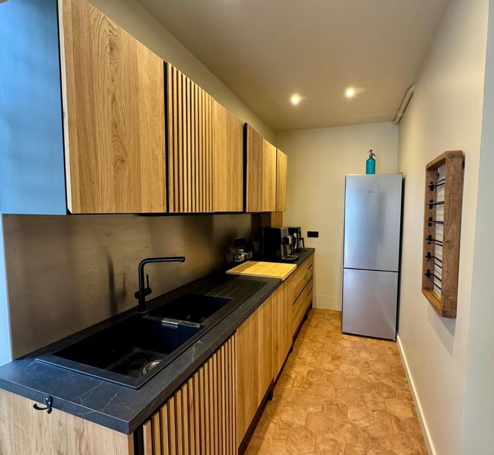 Kitchen or kitchenette, dishwasher, oven, stove