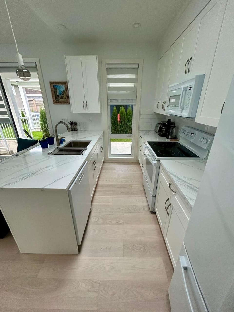 Kitchen or kitchenette, dishwasher, oven, stove