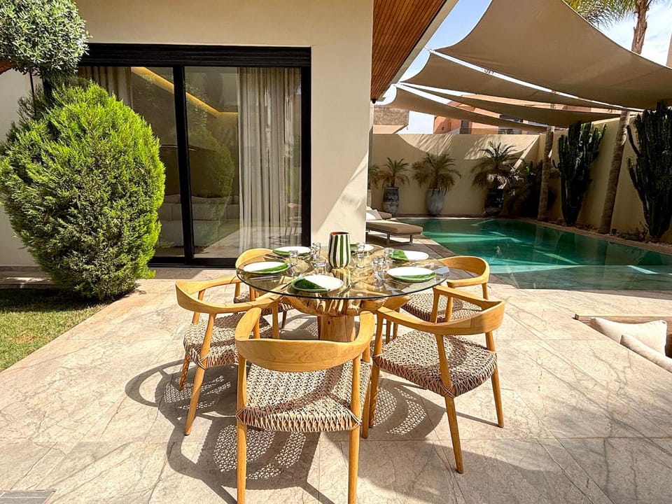 Property building, Patio, Day, View (from property/room), Balcony/Terrace, Living room, Seating area, Dining area, Pool view, Swimming pool, sunbed