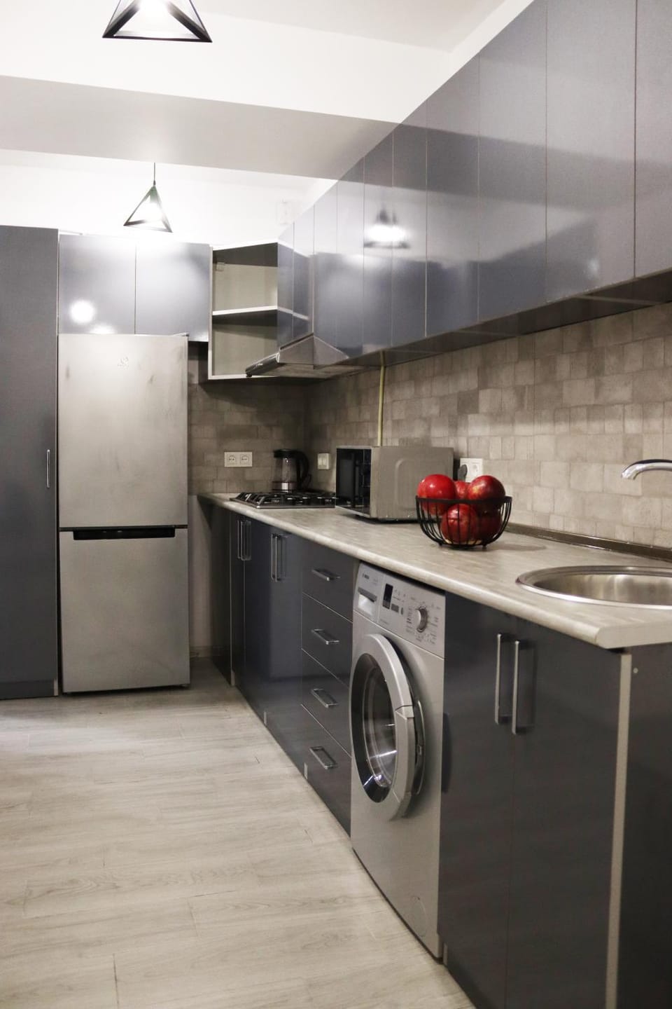 Kitchen or kitchenette, microwave, oven, stove