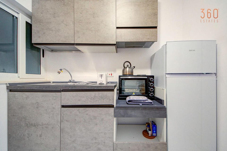 Kitchen or kitchenette, dishwasher, oven, stove