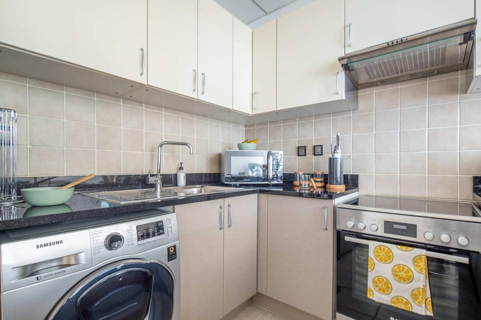 Kitchen or kitchenette, stove, washing machine