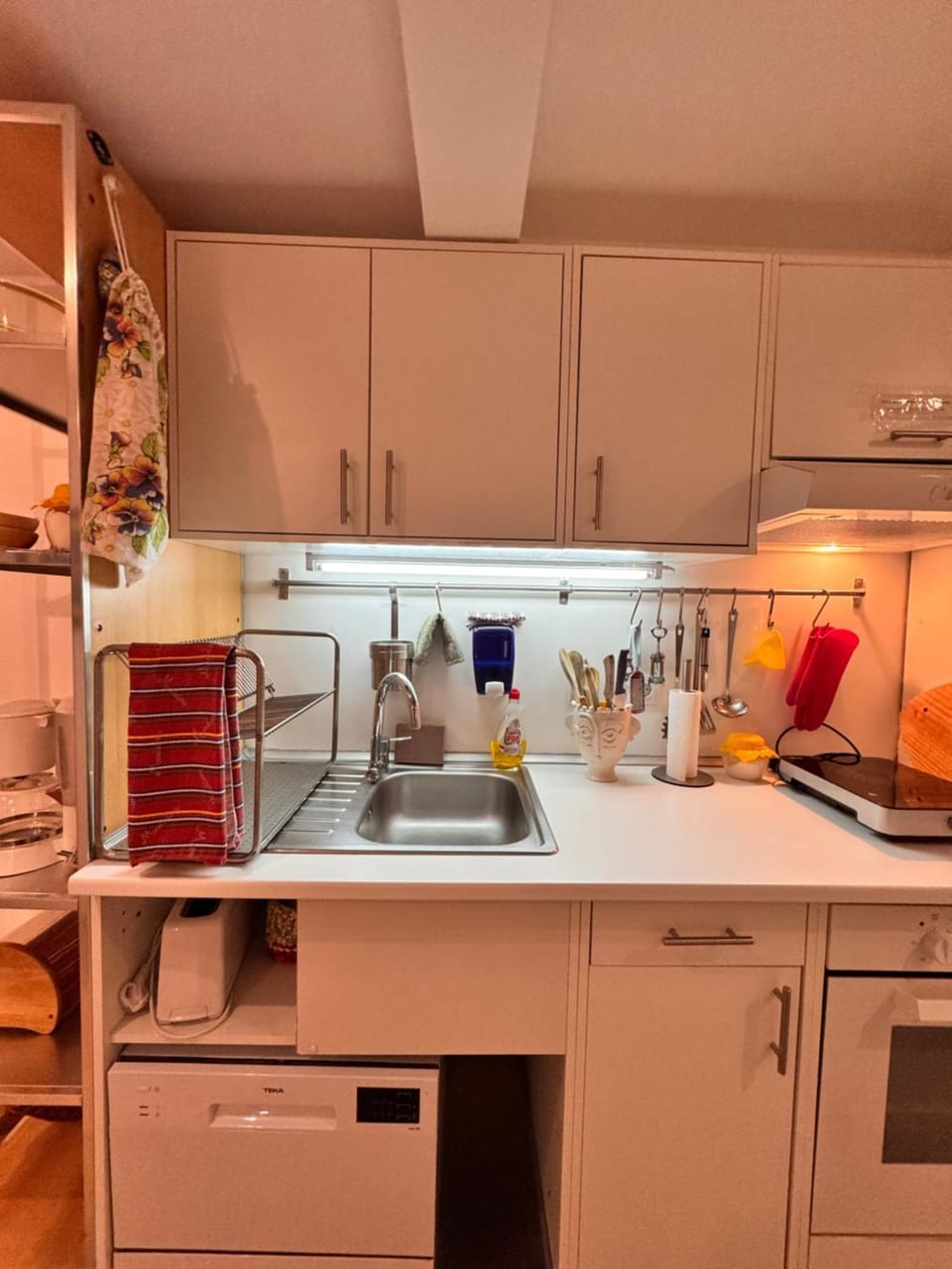 Kitchen or kitchenette, dishwasher, oven, stove