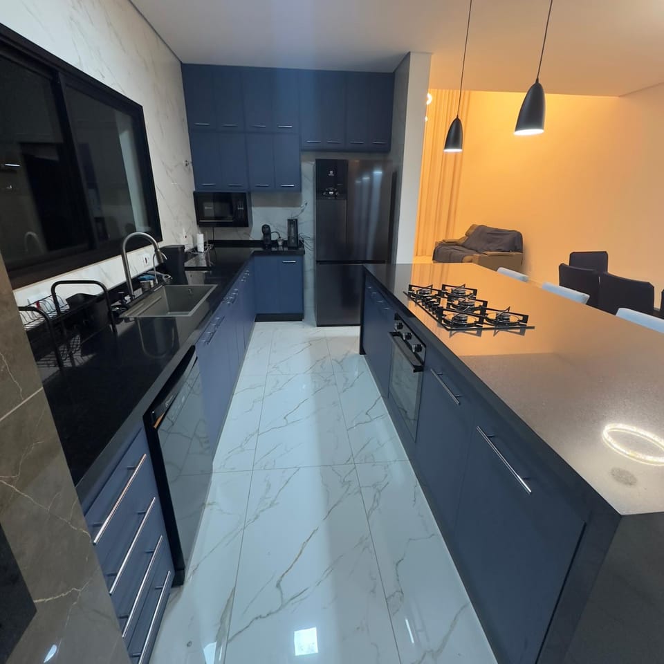 Kitchen or kitchenette, dishwasher, oven, stove