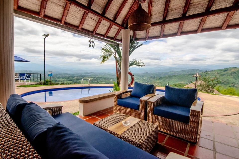 Natural landscape, Living room, Seating area, Mountain view, Pool view
