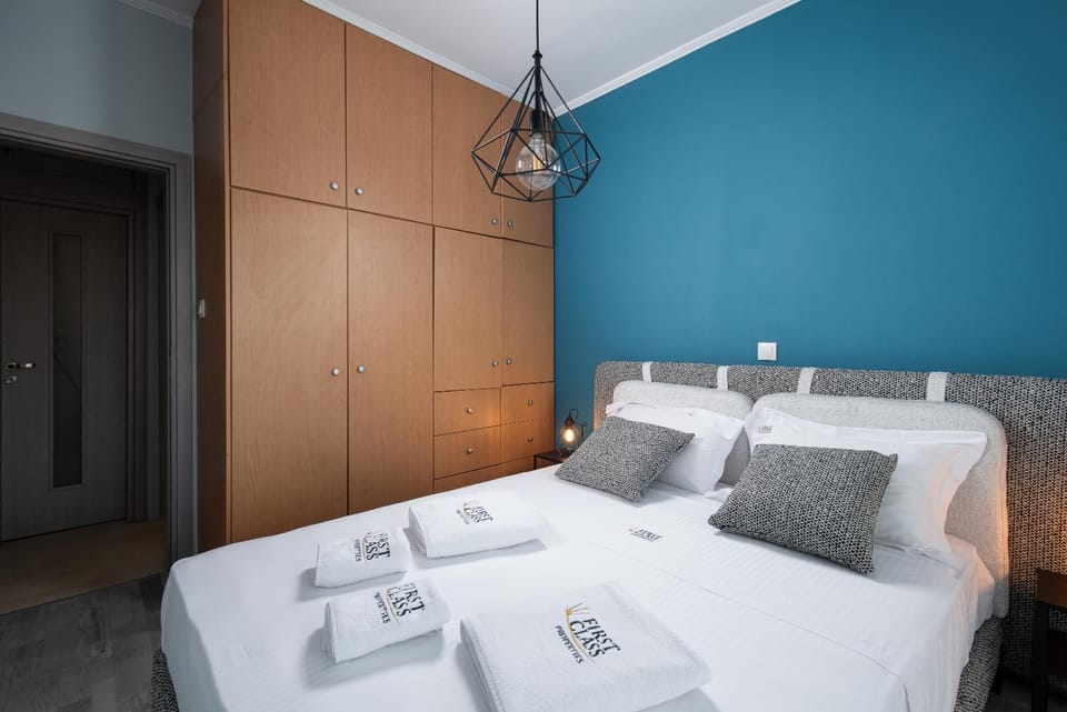 Bed, towels, wardrobe