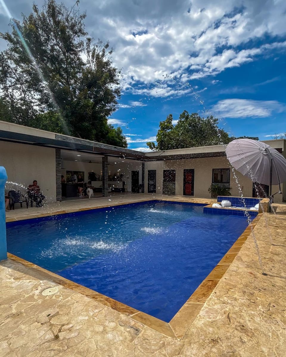 Property building, Day, Pool view, Swimming pool, sunbed