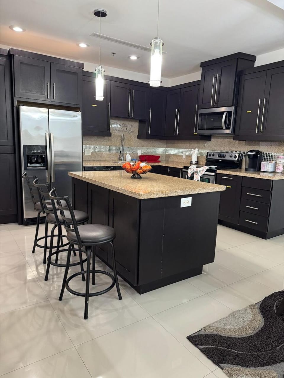 Kitchen or kitchenette, dishwasher, oven, stove