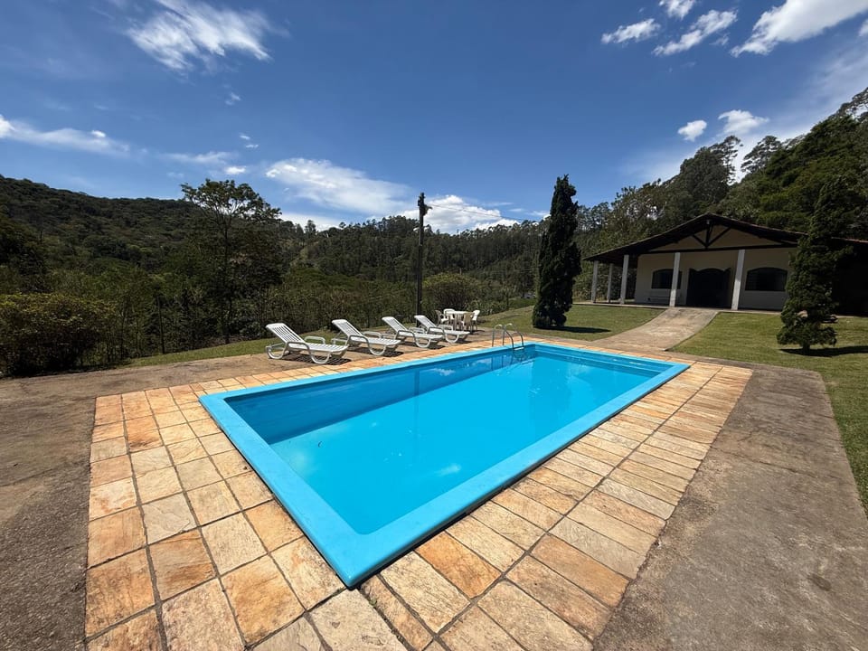 Property building, Day, Natural landscape, Mountain view, Pool view, Swimming pool, sunbed