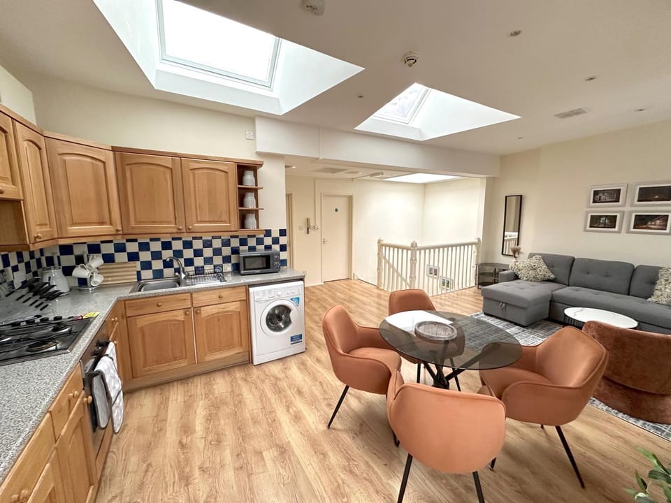 Kitchen or kitchenette, Seating area, Dining area, oven, stove, washing machine