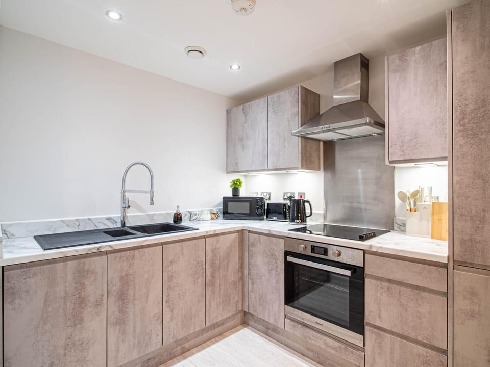 Kitchen or kitchenette, dishwasher, oven, stove, toaster