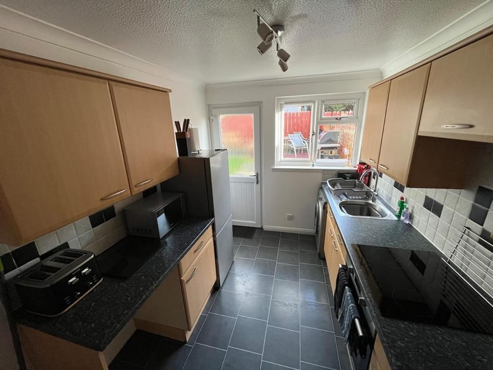 Kitchen or kitchenette, oven, stove, toaster
