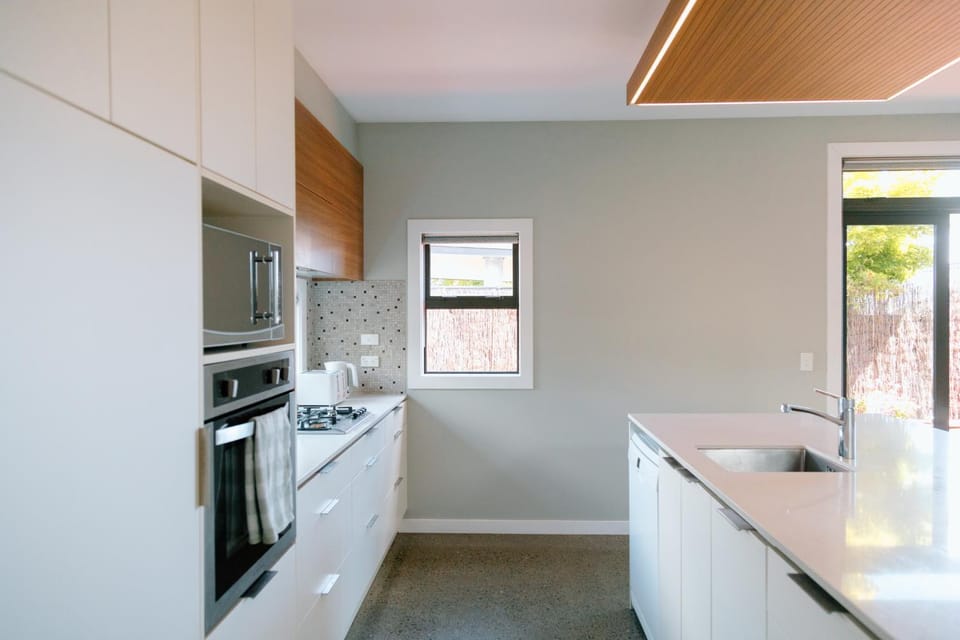 Kitchen or kitchenette, dishwasher, oven, stove