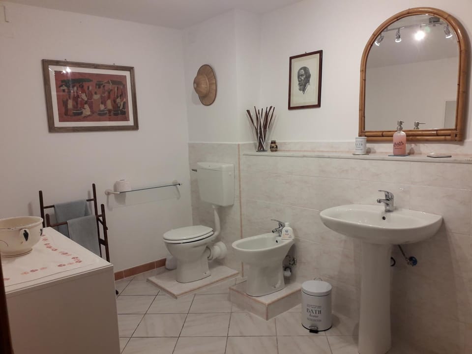 Toilet, Bathroom, bidet, hair dryier, towels