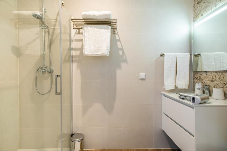 Shower, Toilet, Bathroom, hair dryier, towels