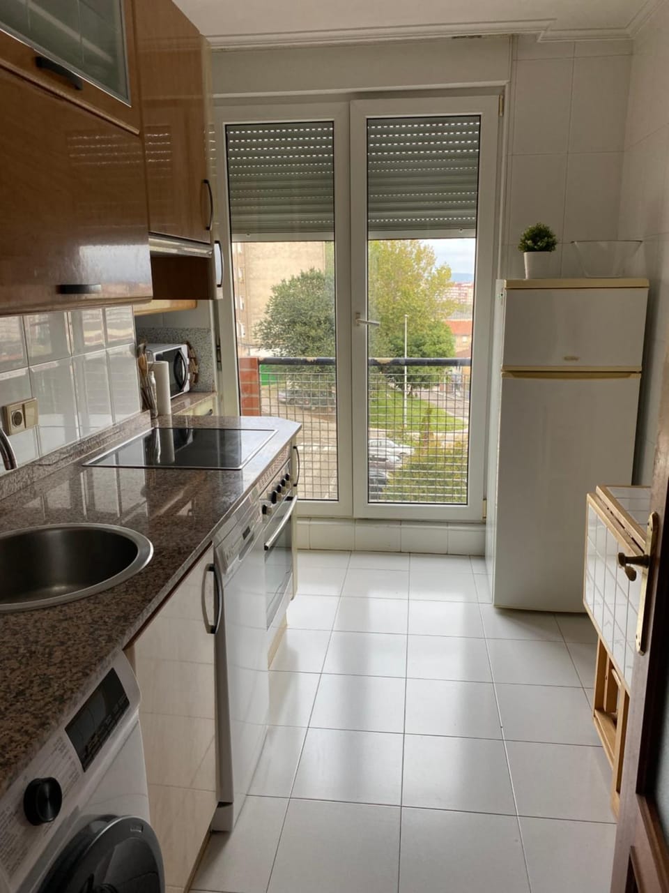 Kitchen or kitchenette, dishwasher, oven, stove