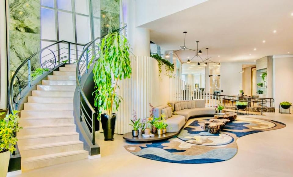 Property building, Garden, Living room, Lobby or reception, Seating area, concierge