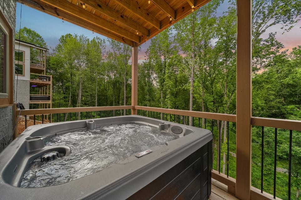 Stay & Sway at this Luxe Modern Retreat with Indoor Pool, Hot Tub, Putting Greens & Fire Pit House in Gatlinburg