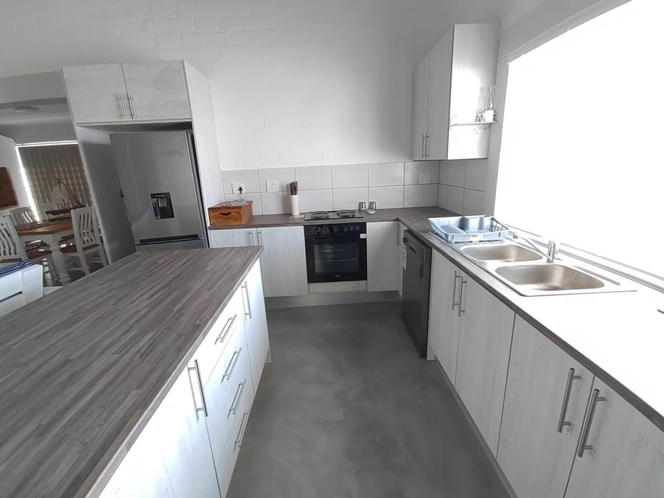 Kitchen or kitchenette, dishwasher, microwave, oven, stove