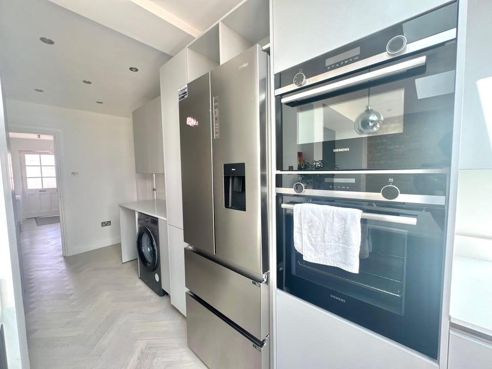 Kitchen or kitchenette, dishwasher, oven, stove