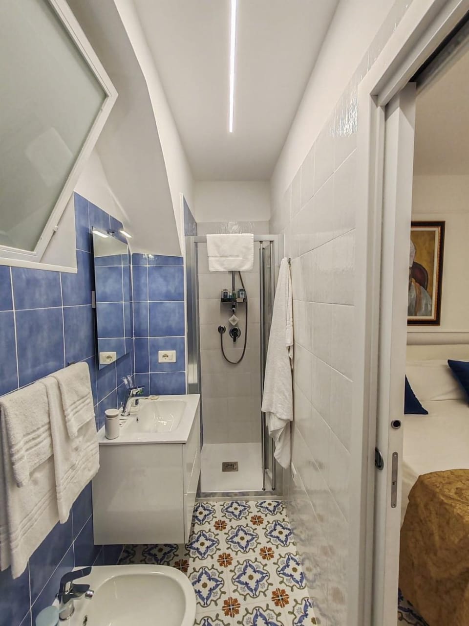 Shower, Toilet, Bathroom, hair dryier, towels, washing machine, dryer
