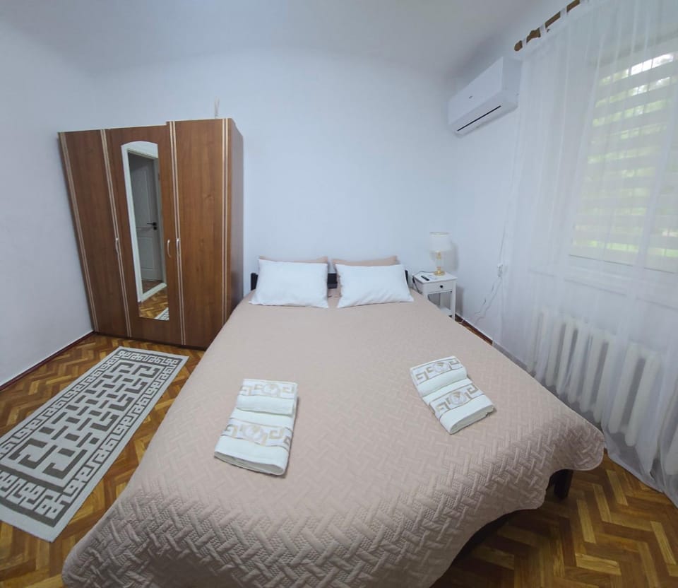 Bed, towels, wardrobe, air conditioner