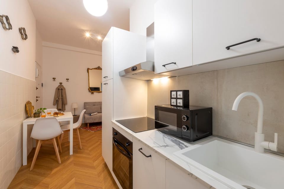 Kitchen or kitchenette, dishwasher, oven, stove