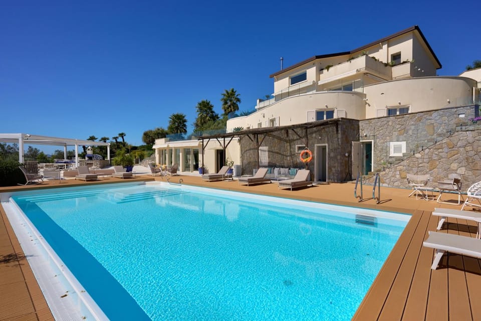 Property building, Day, Pool view, Swimming pool, sunbed