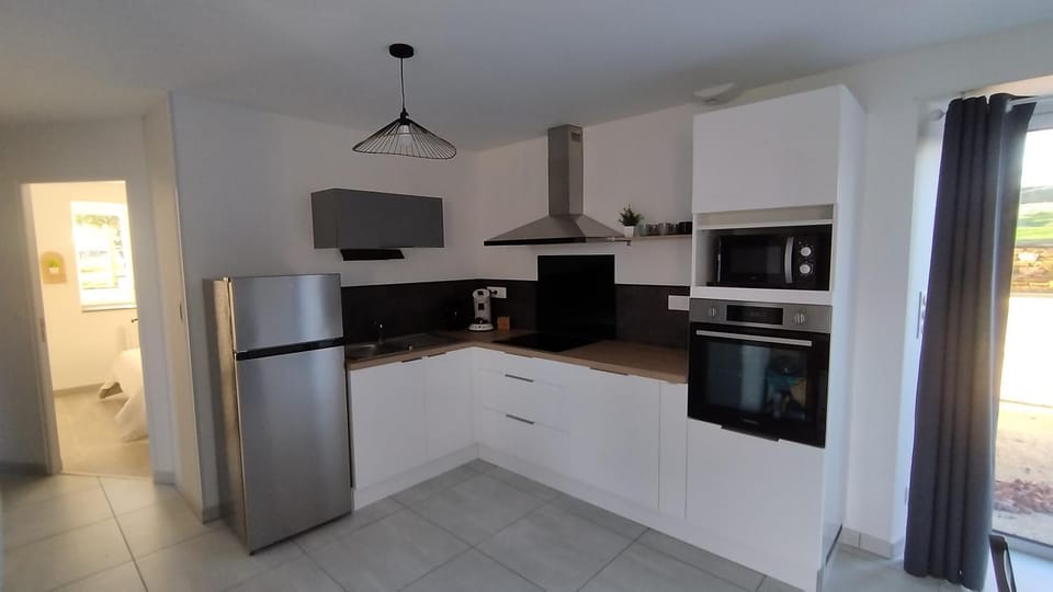Kitchen or kitchenette, dishwasher, oven, stove, toaster
