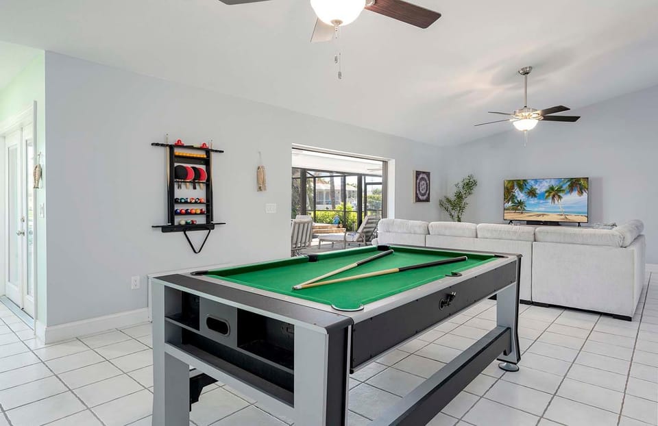 Latitude Adjustment - near Eight Lakes with Pool Table, Boat Dock & Jacuzzi Villa in Cape Coral