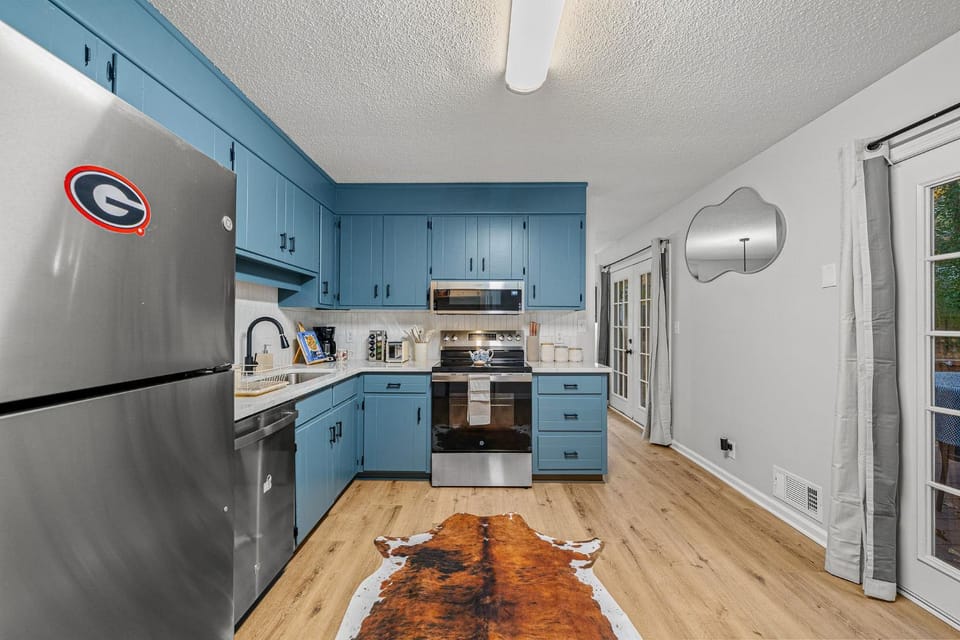 Kitchen or kitchenette, dishwasher, microwave, oven, stove