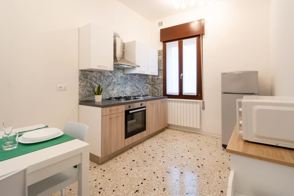 Kitchen or kitchenette, microwave, oven, stove