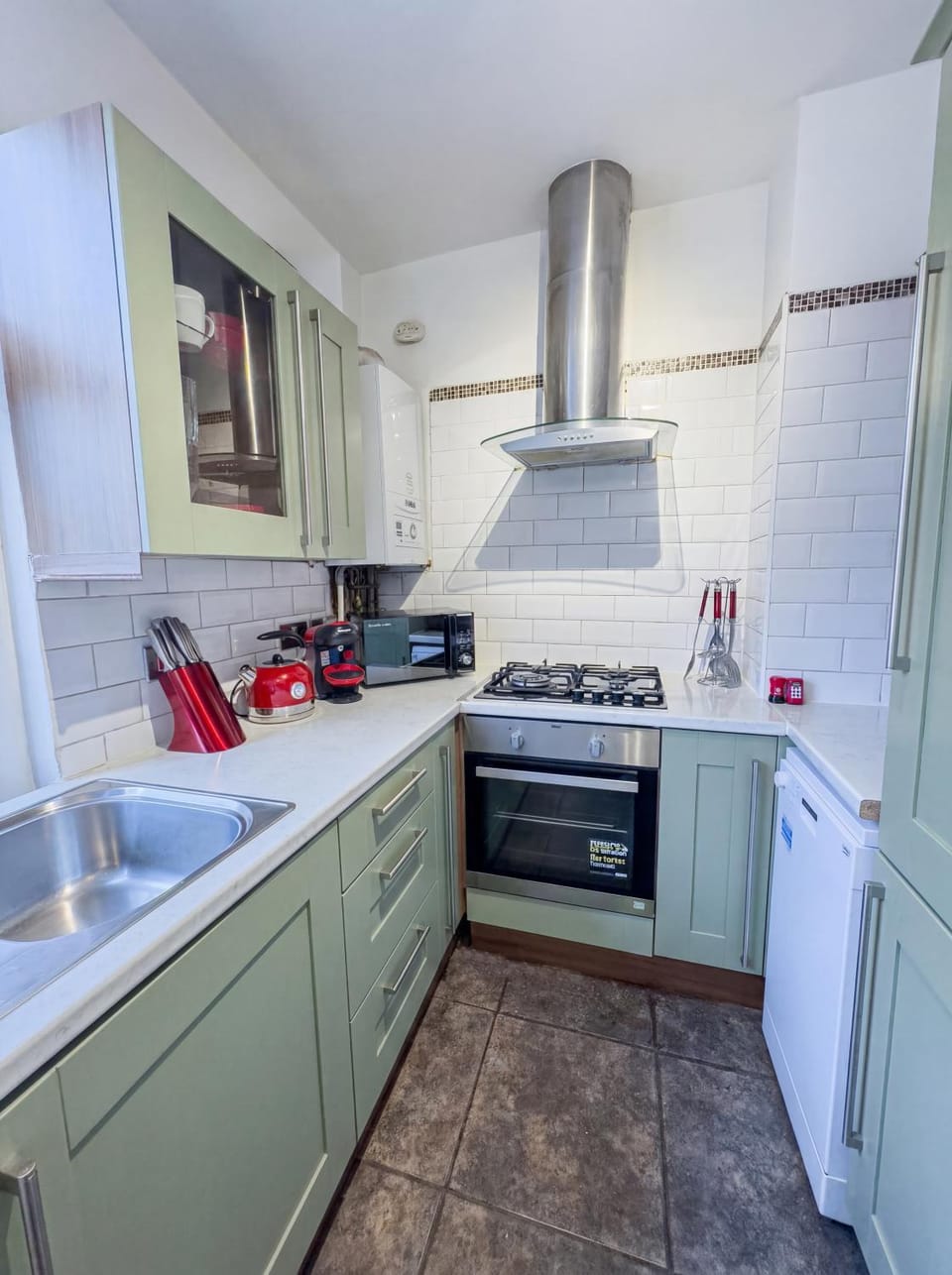 Kitchen or kitchenette, dishwasher, oven, stove, toaster