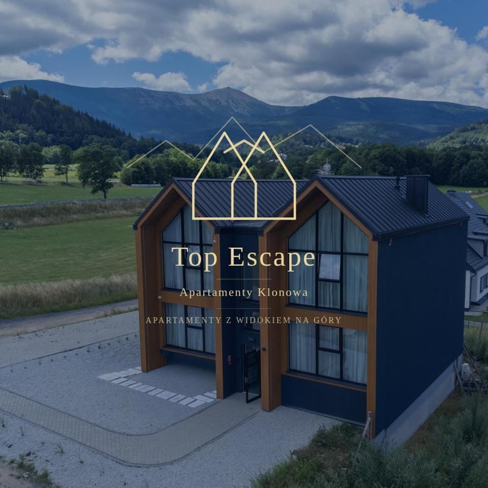 Property building, Day, Property logo or sign, Natural landscape, Logo/Certificate/Sign, Text overlay, Mountain view, Street view, Certificate/Award