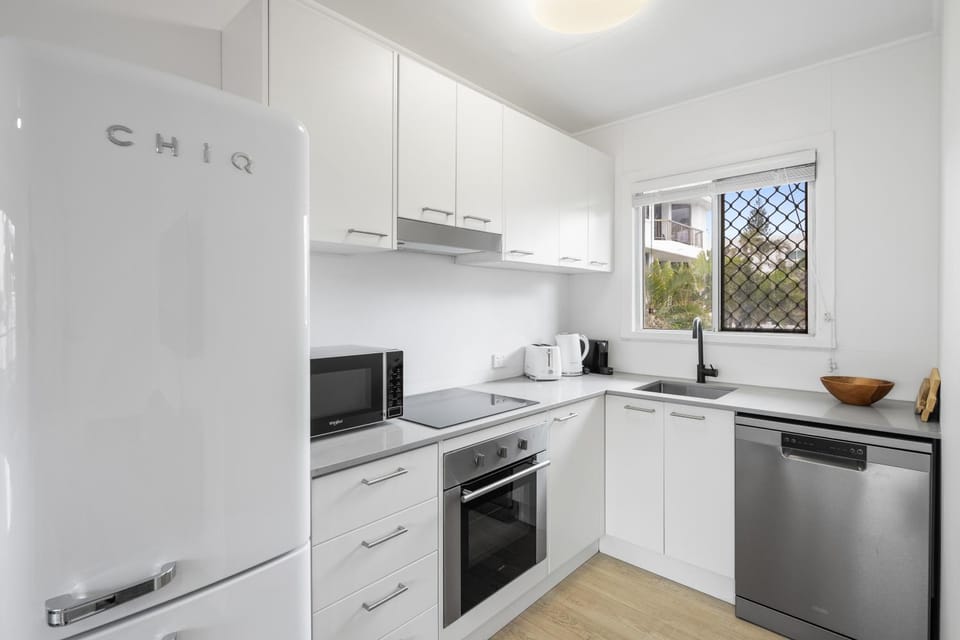 Kitchen or kitchenette, dishwasher, oven, stove, toaster