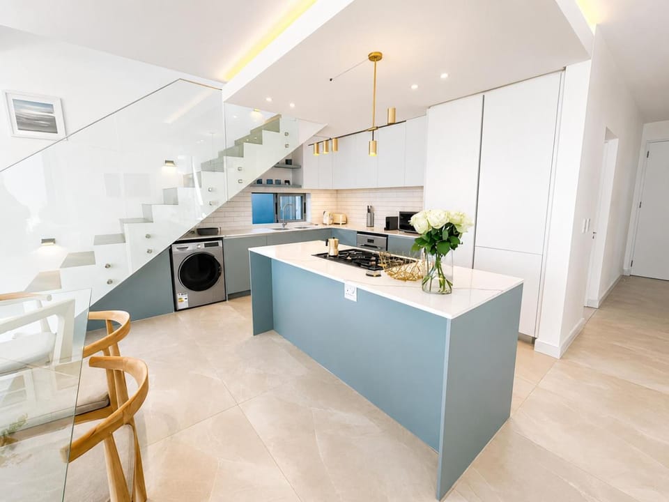 Kitchen or kitchenette, dishwasher, microwave, oven, stove, washing machine, dryer