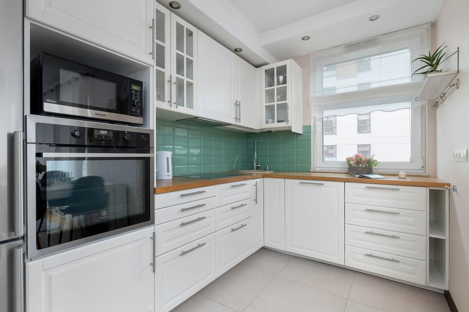Kitchen or kitchenette, dishwasher, oven, stove